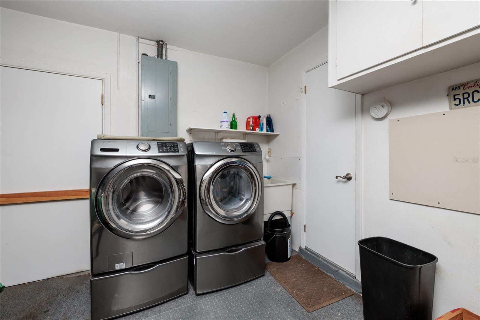 Washer dryer and sink in garage