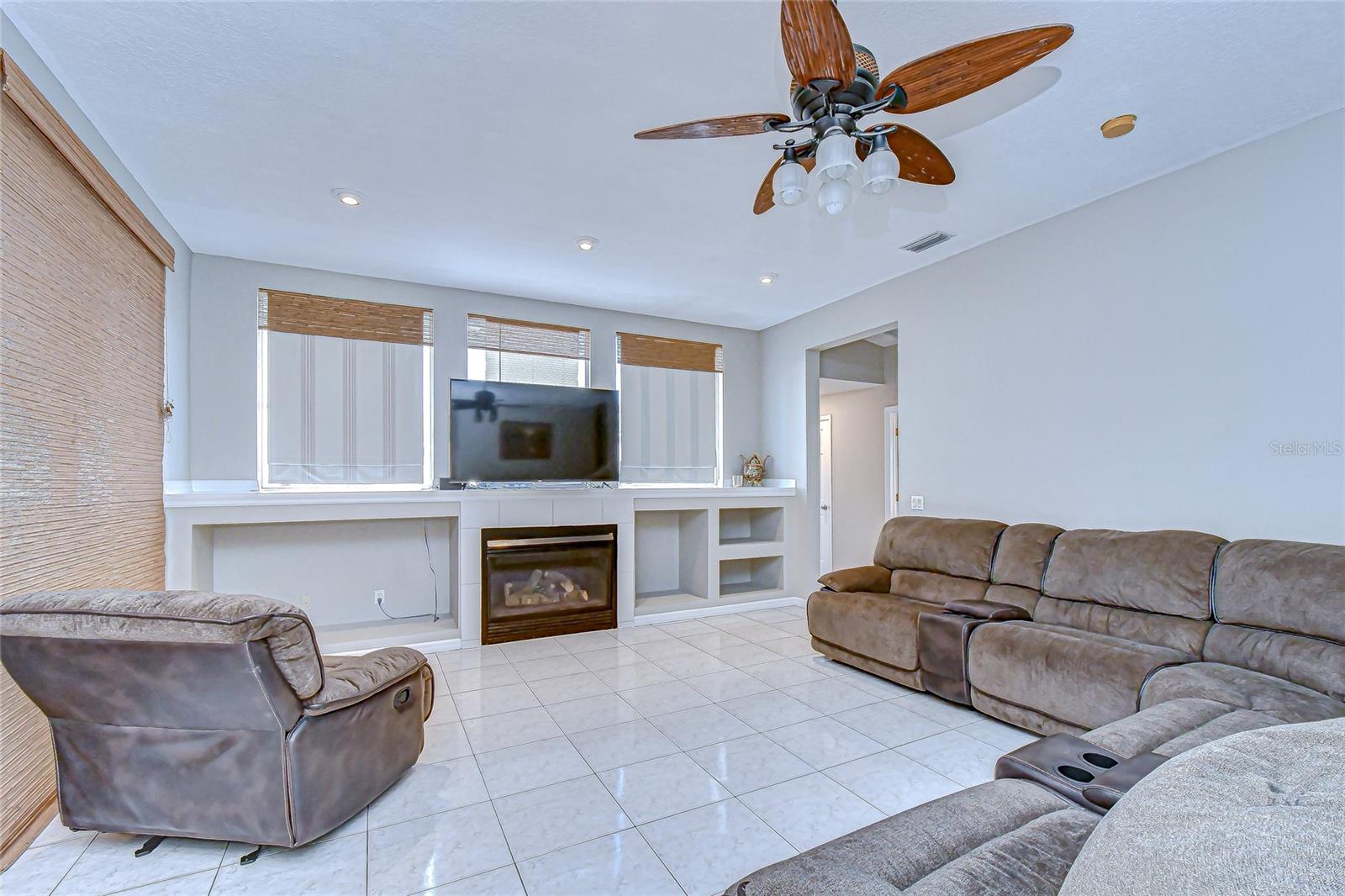 Cozy family room with built-ins and a fireplace—your comfort zone.