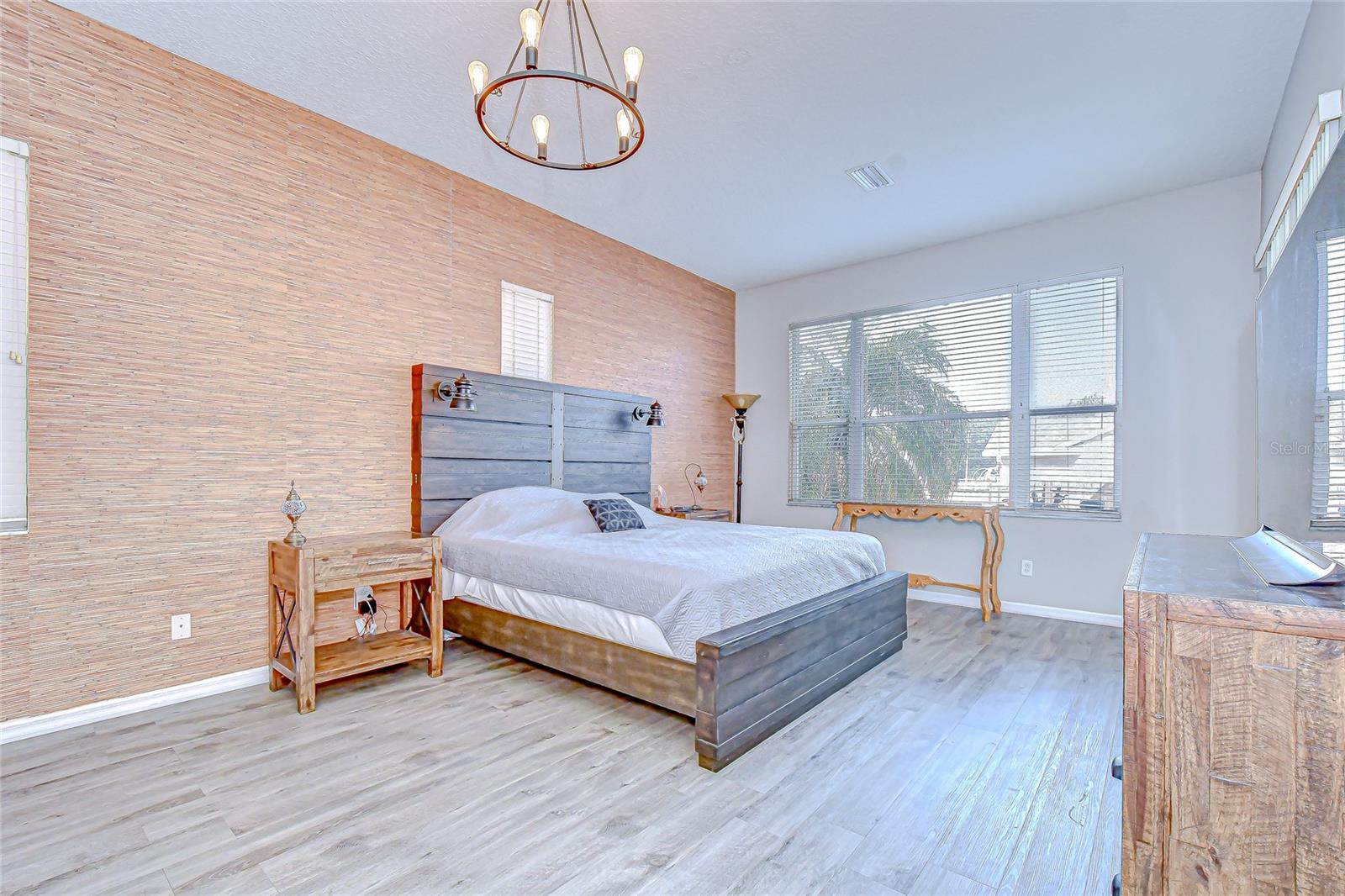 Secluded primary suite with private lanai access—your personal retreat.