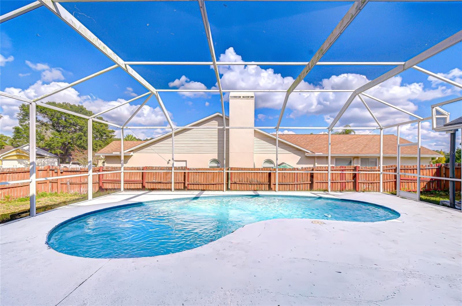 Extended screened lanai with pool—your private Florida paradise.