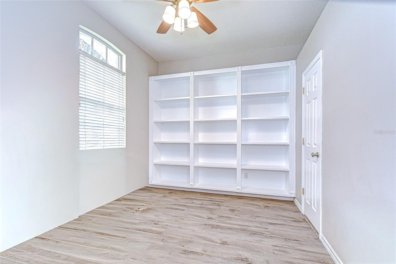 Dedicated office with built-in shelving—work from home in style.