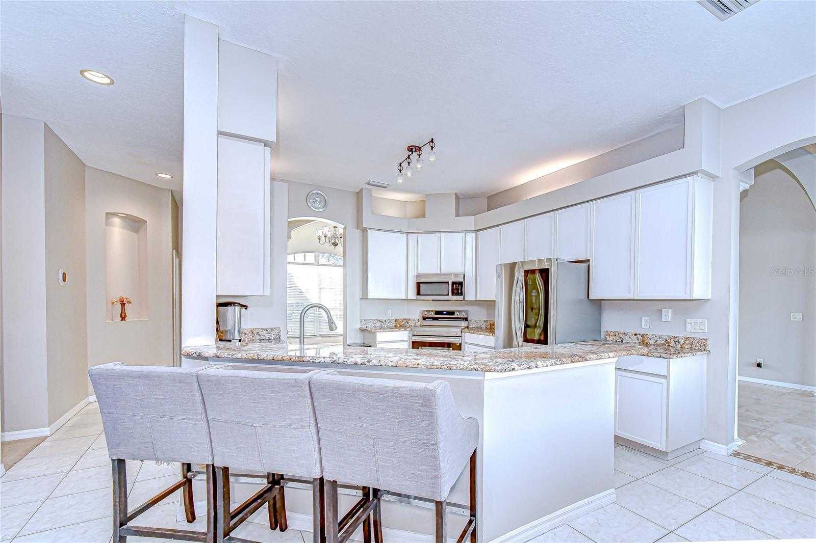 Tons of storage, prep space, and breakfast bar seating for casual meals.