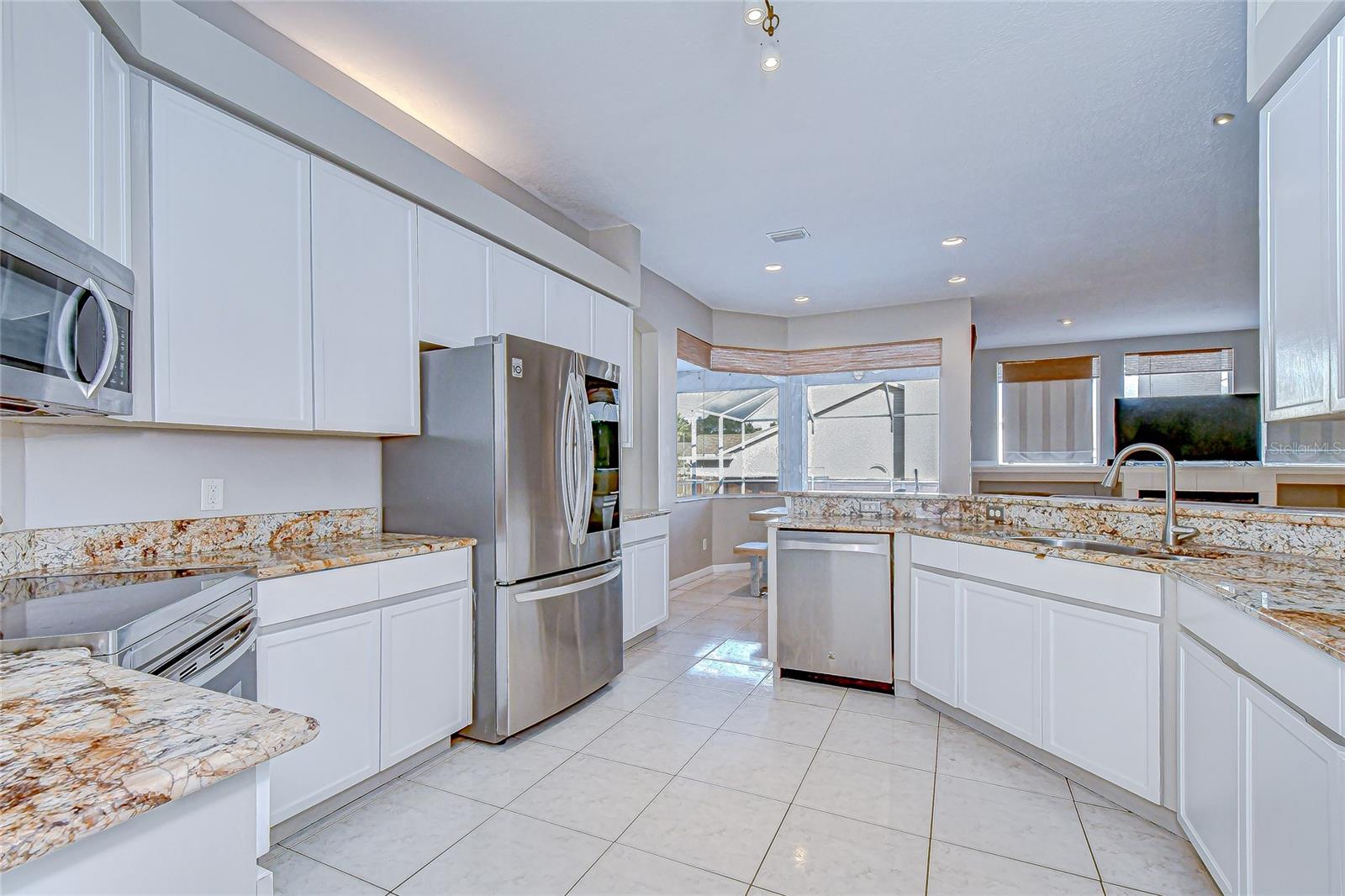 Open concept living meets kitchen convenience.