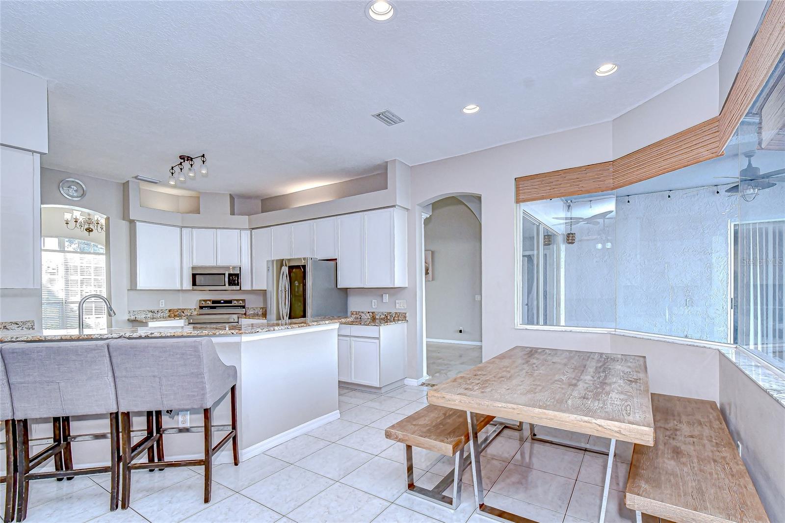 A bright breakfast nook with a bay window—start your mornings in style.