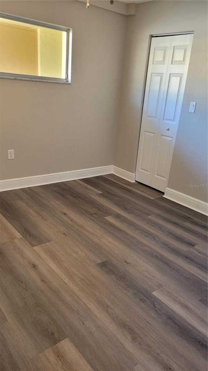 Guest bedroom also has luxury plank vinyl floors
