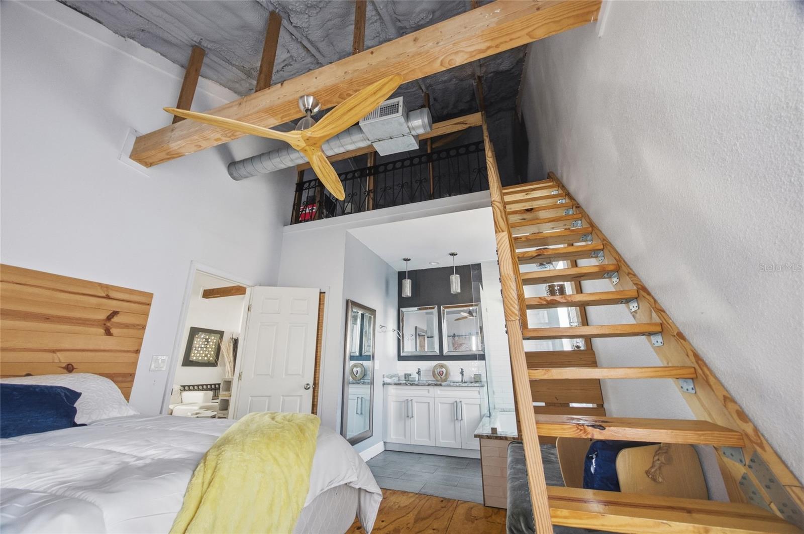 Staircase to the loft in primary bedroom.