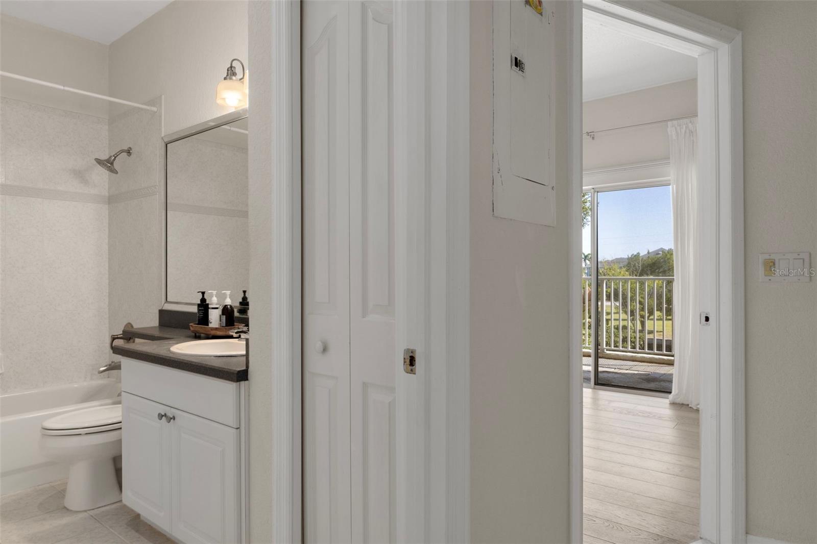 Guest bath and door to guest room