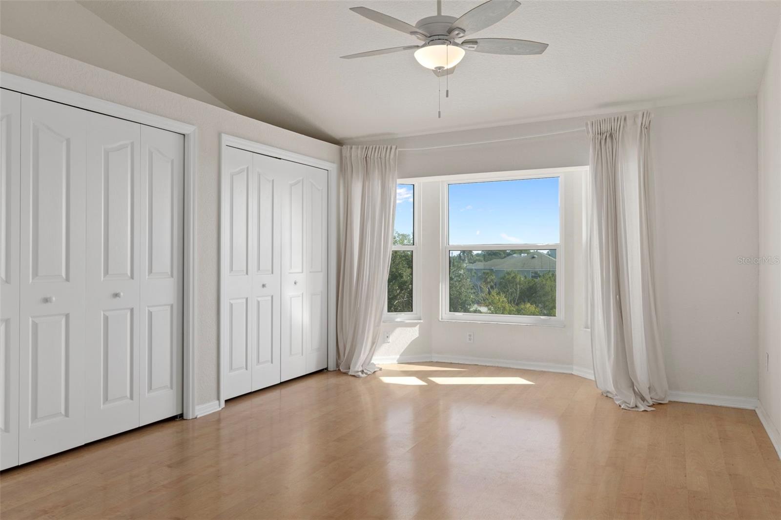 Master suite with bay window and large closet