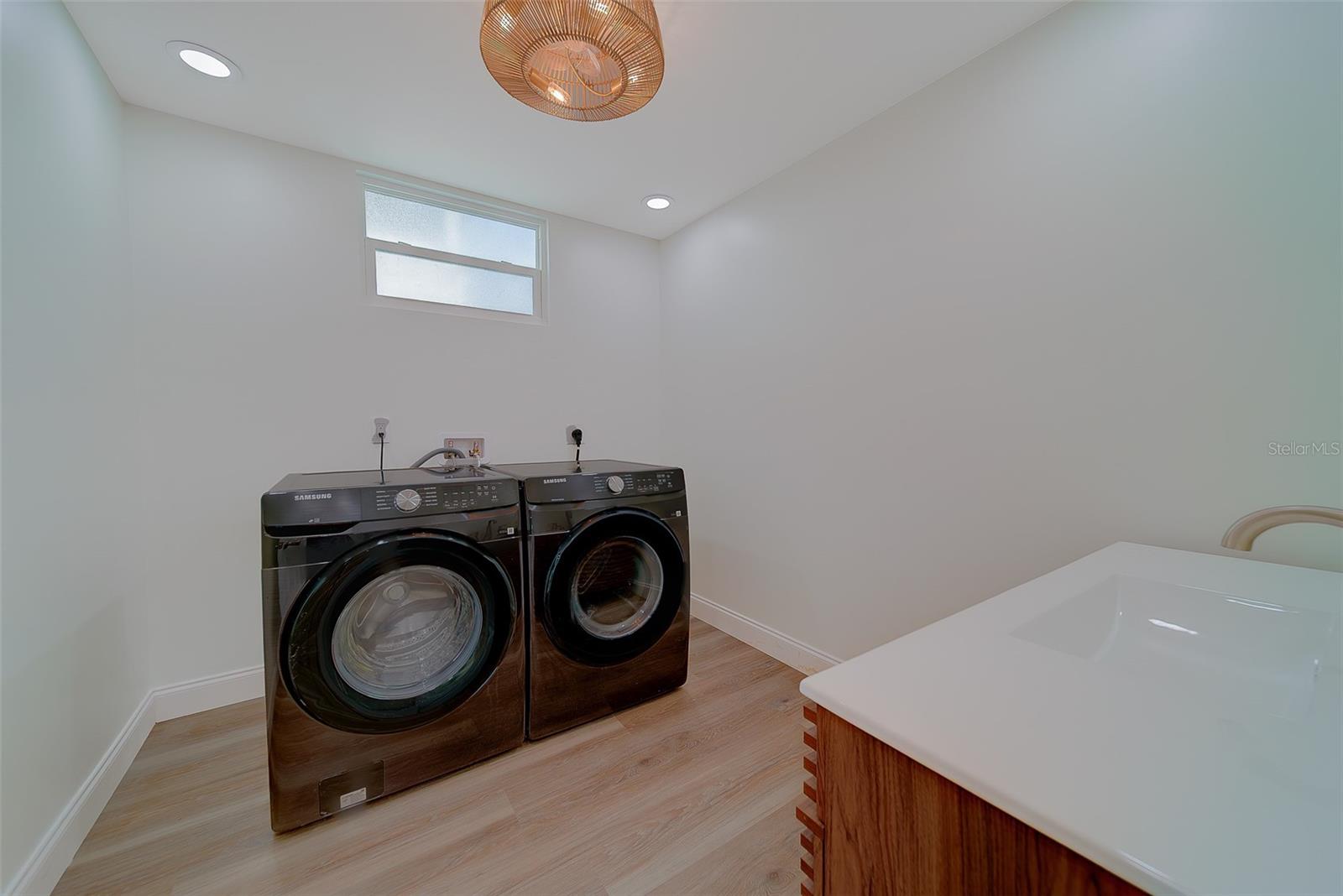 Laundry room with new black stainless Samsung washer & dryer