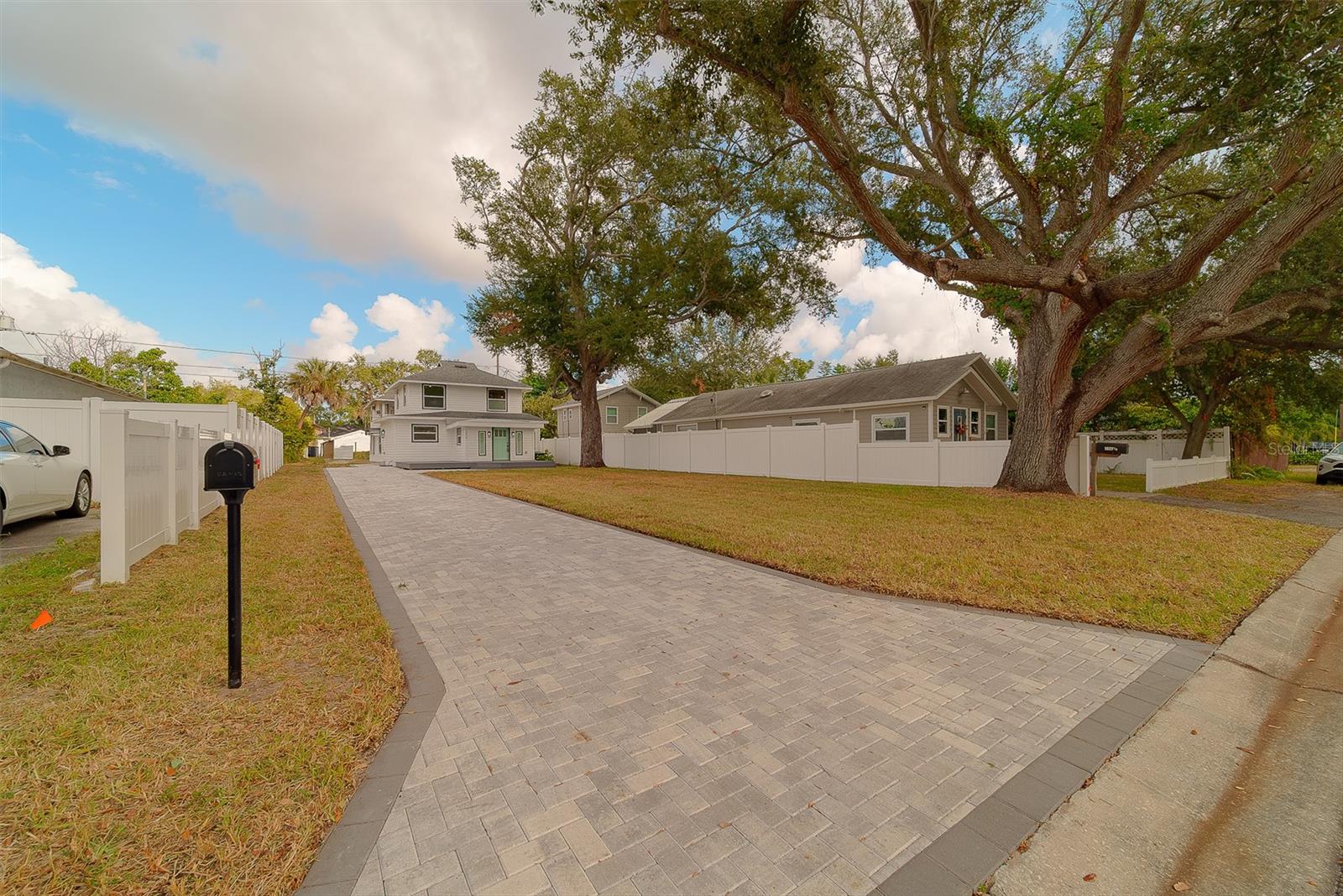 Extended new paver driveway can easily fit 4-5 vehicles.