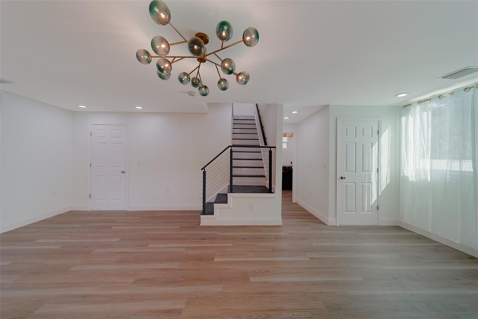 Dining room (Left is door to garage, right is door to 1/2 bath)