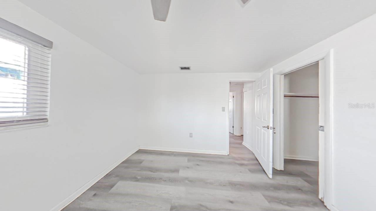 Primary bedroom with spacious walk-in closet and bedroom’s en-suite bath renovation ready for your finishing touch!