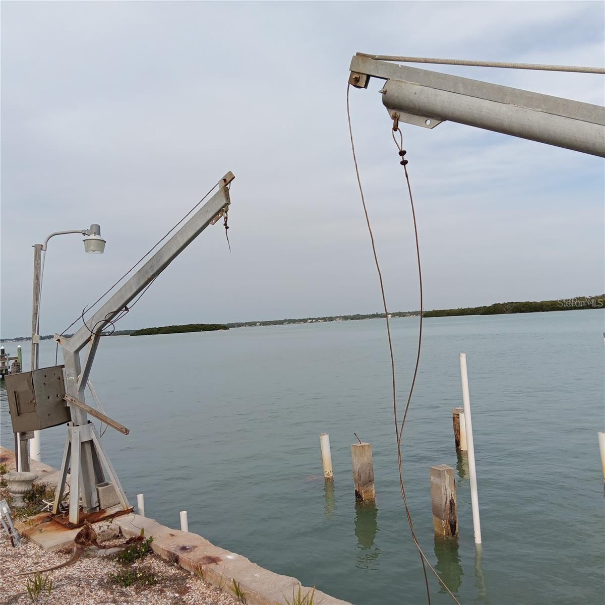 Johns Pass Water Views, Looking East,  Seawall & 2 Davits