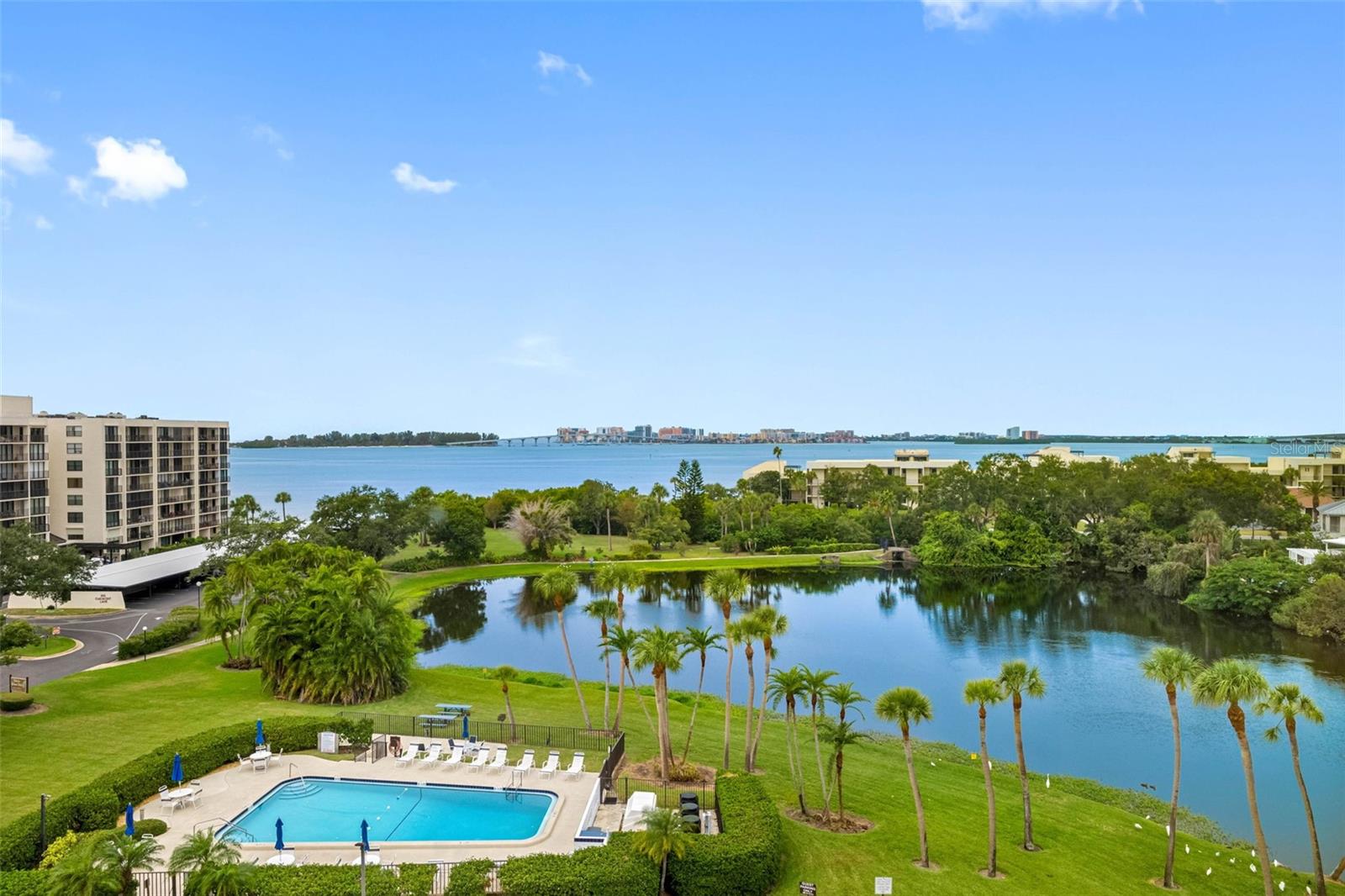 View from your window heated pool, Harolds lake and intracoastal and sand key bridge