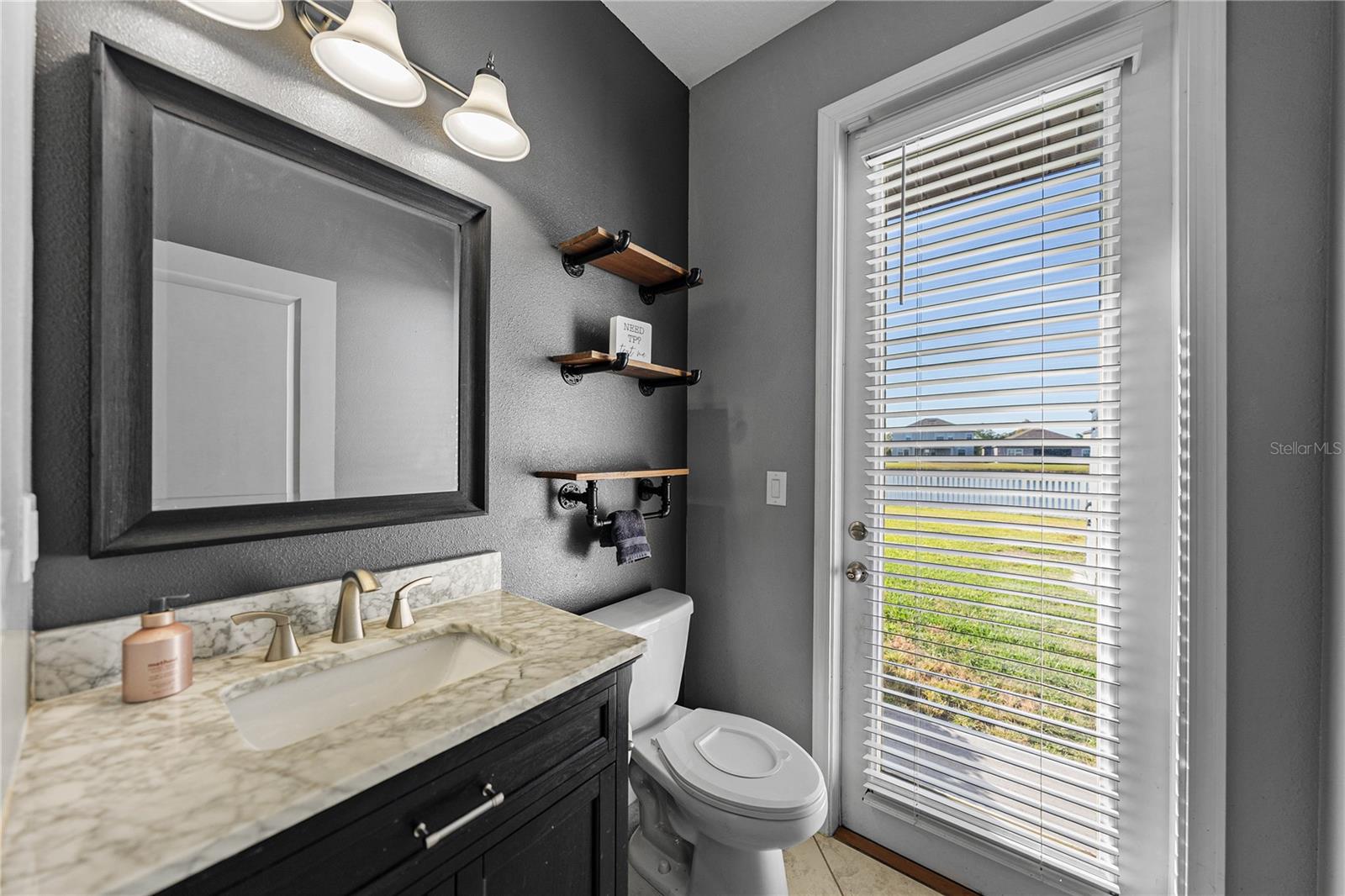 Half bath on first floor can access back yard for entertaining guests