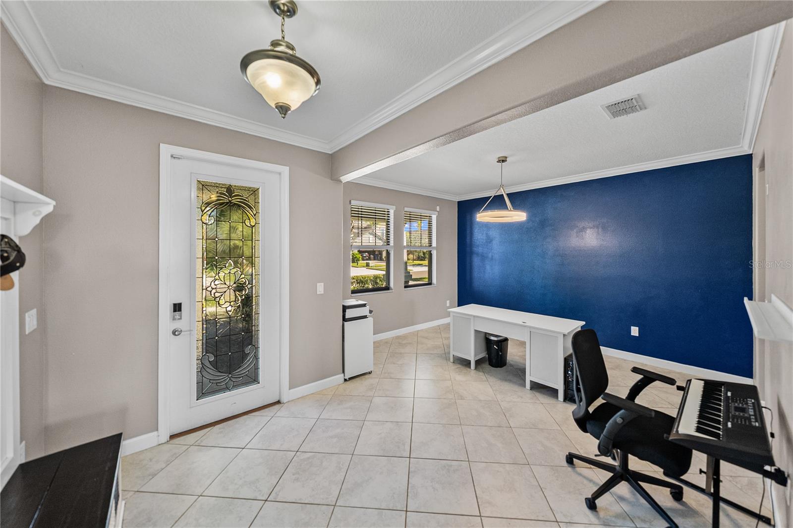 Formal dining room or living room is currently being used as an office
