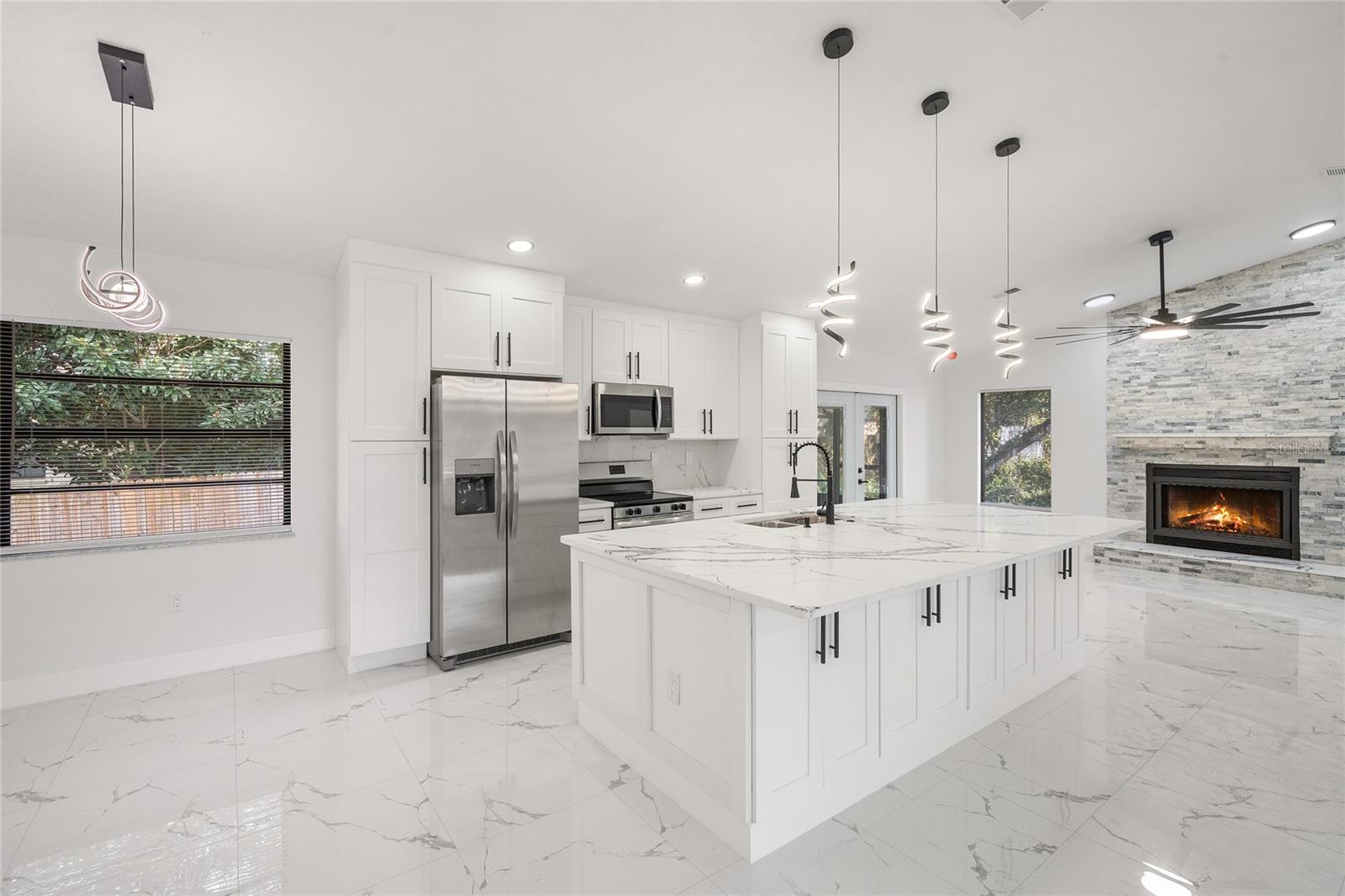 OPEN KITCHEN WITH WALL-TO-WALL NEW CABINET