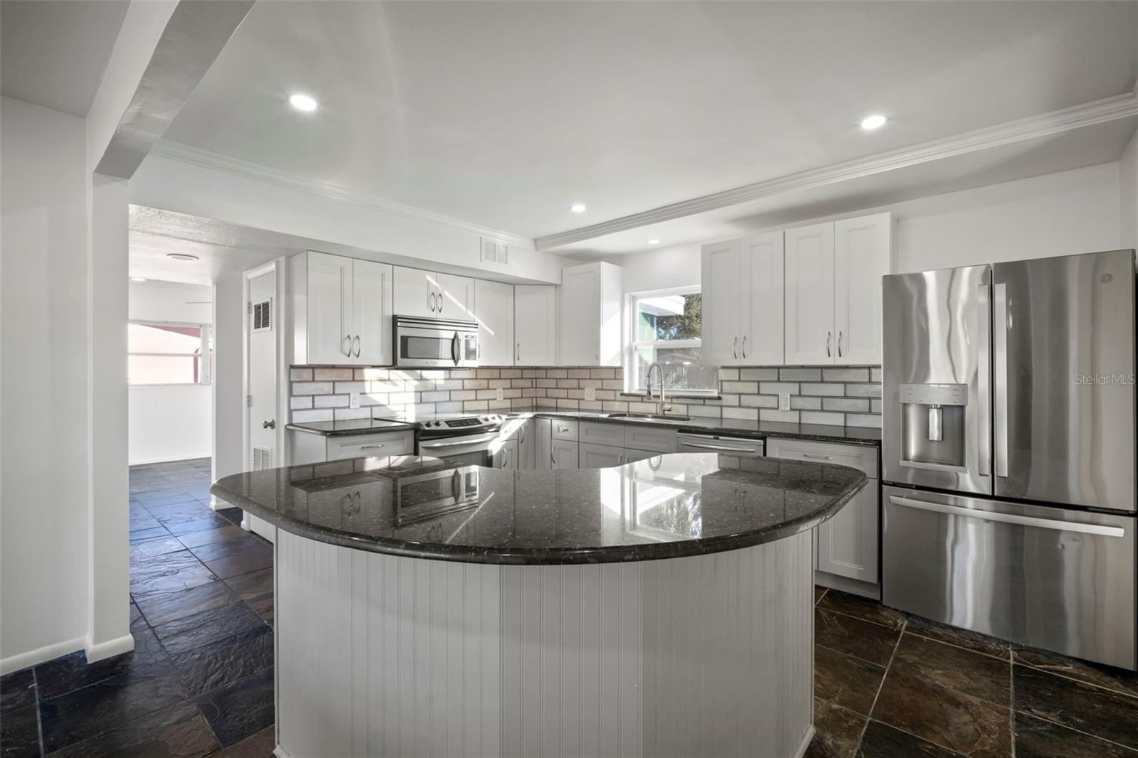 Added Island guest seating and easier food preparation and more cabinet storage.