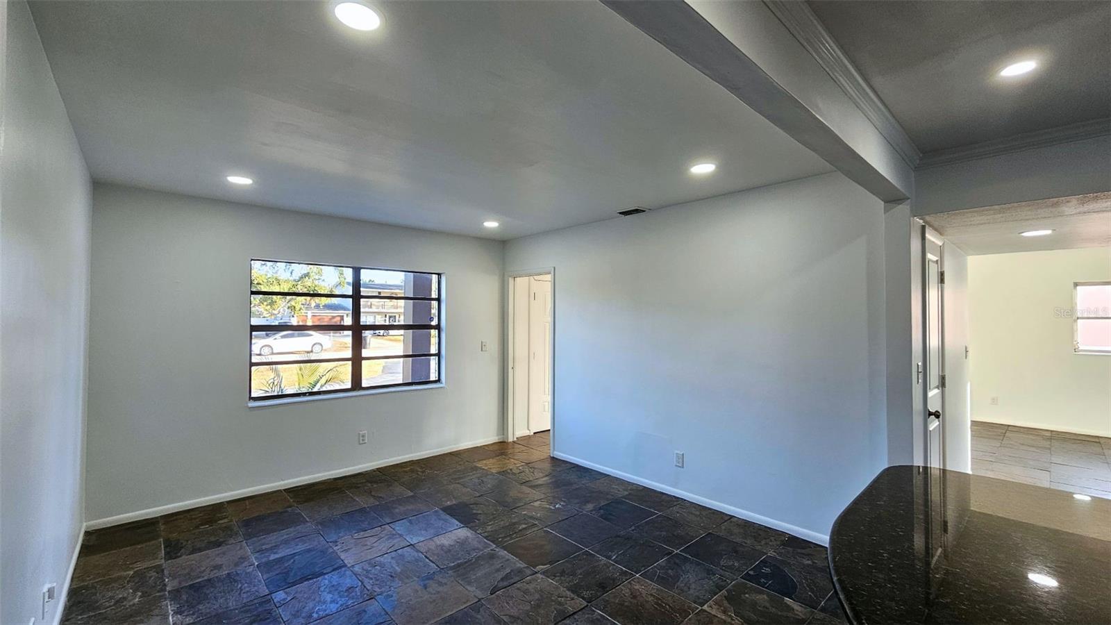 Spacious dining area. Door in background meets at stairs and front entry. Cell phone photo.