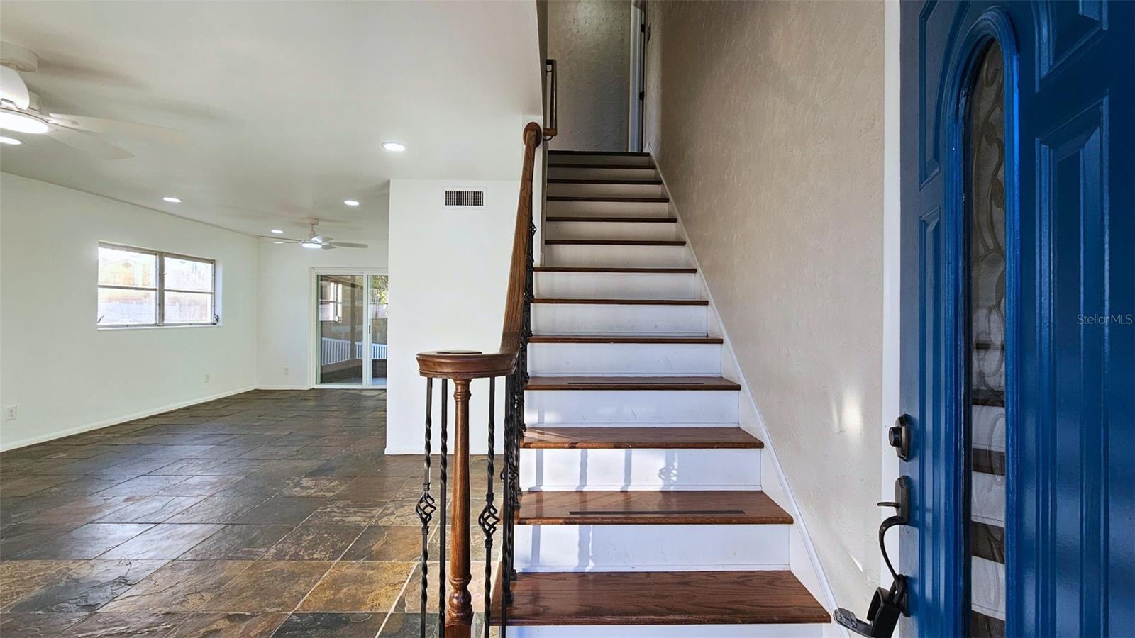 Entry view. Dining area behind door. Room separated by pocket door. Cell phone photo.