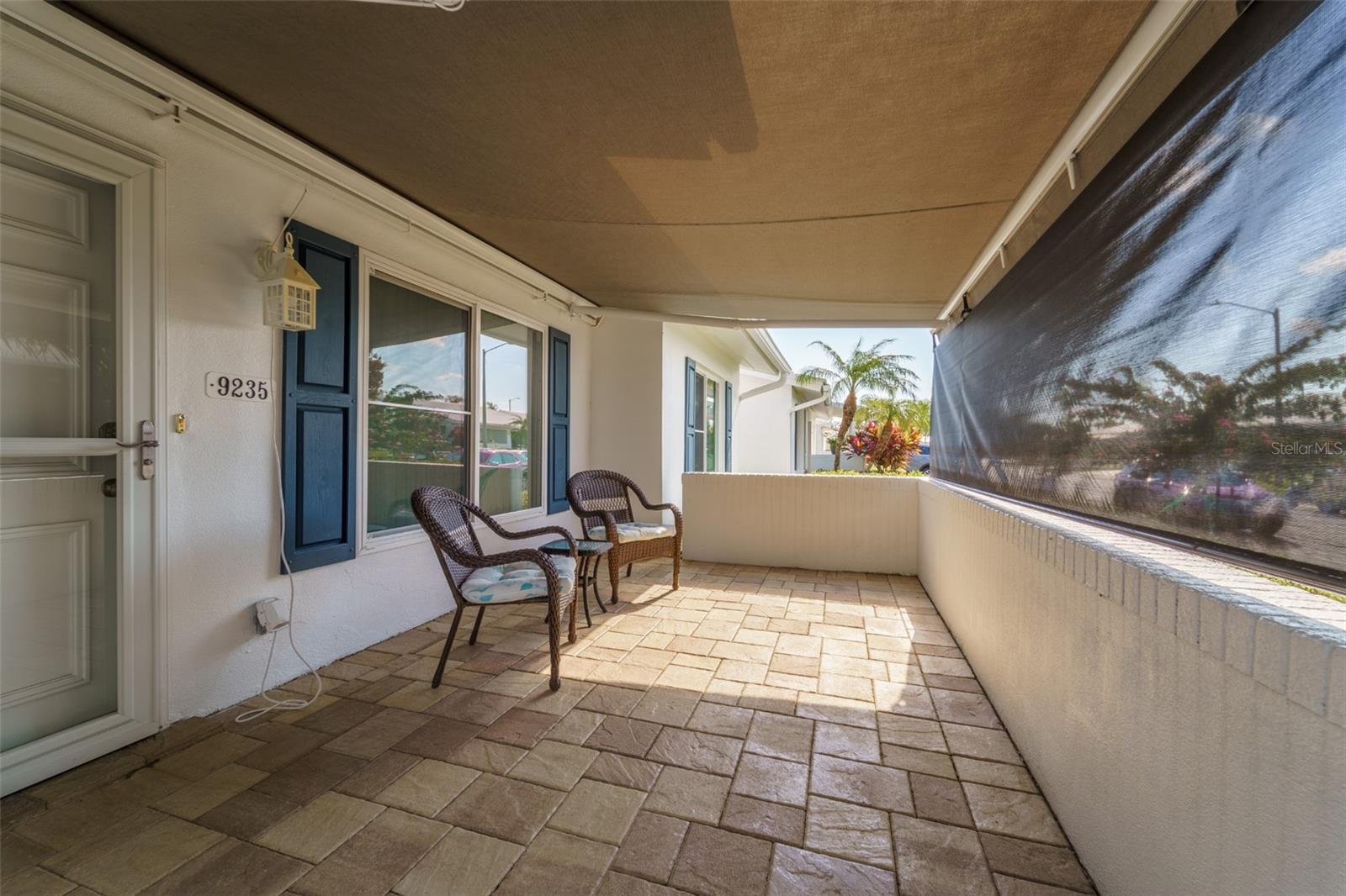 Retractable front porch awning.  LED lighting and optional shade screen.