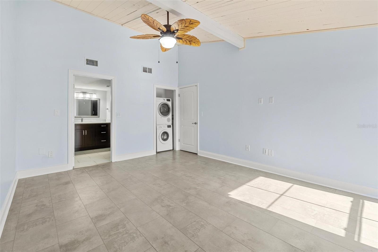 Primary bedroom with built in washer/dryer