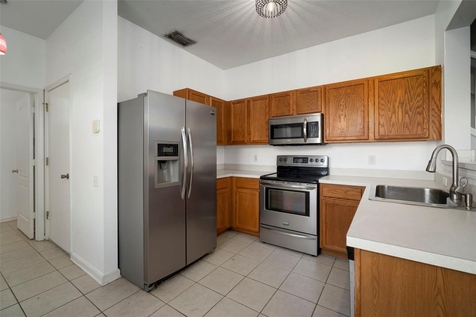 "Corner Unit Extra Windows" provides gorgeous natural light. Waterview also present from kitchen window.