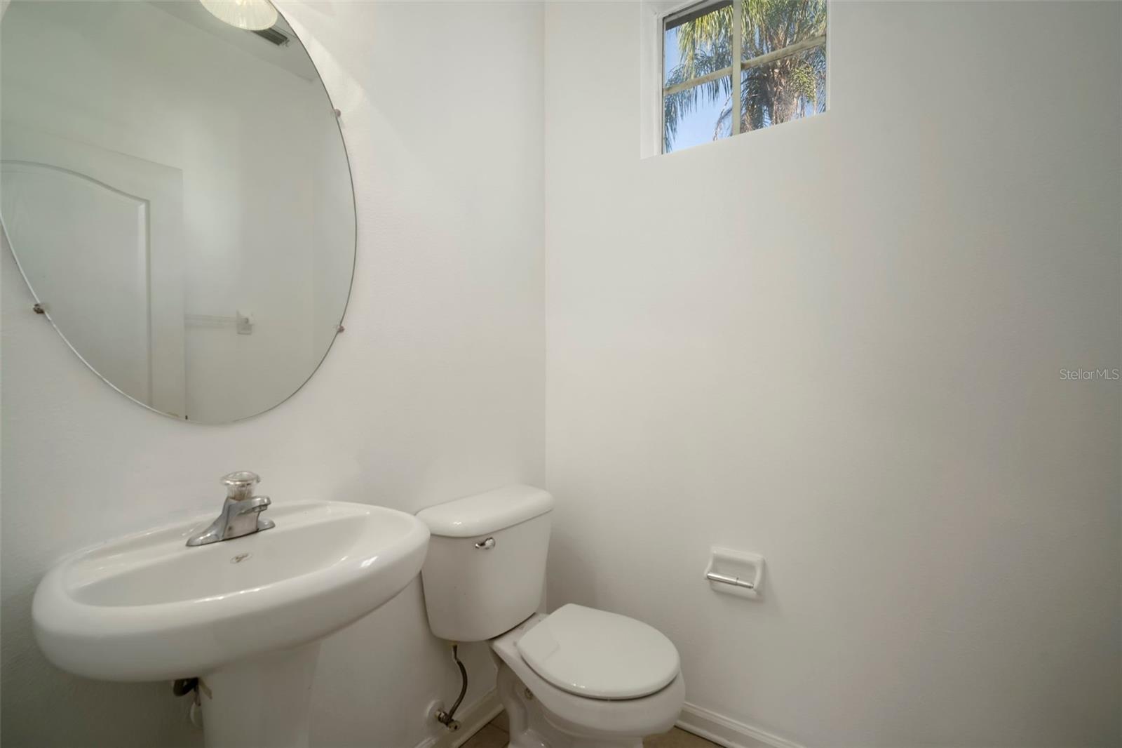 Half Bath. Located on 1st Floor between the Kitchen and Garage. Making so convenient to bring groceries in.