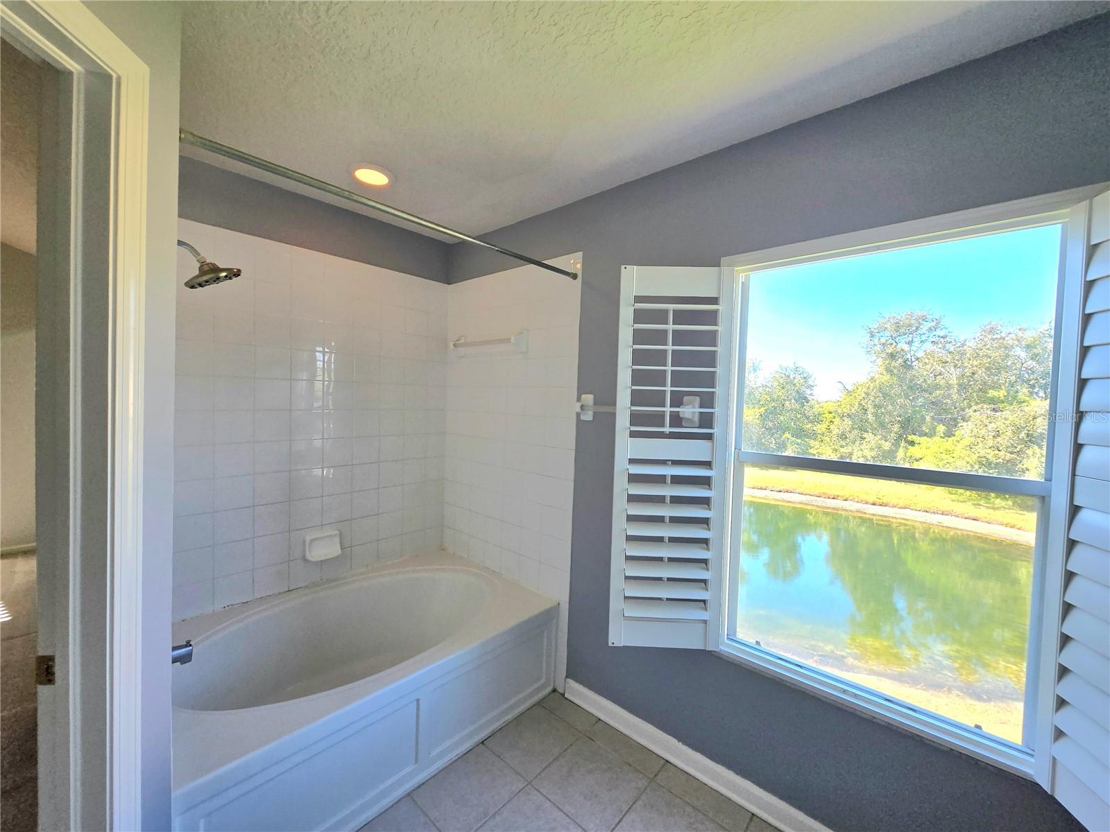 Image interior dimmed to show actual waterview from ensuite.