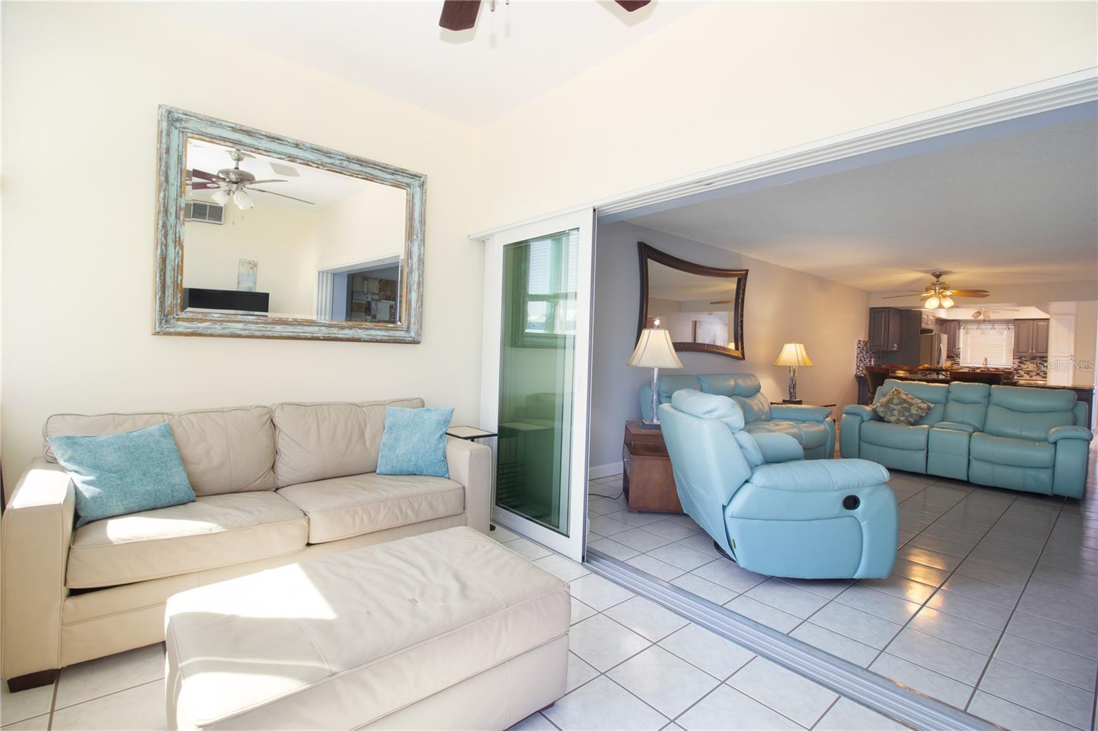 Sofa sleeper makes this Florida room a great flex space