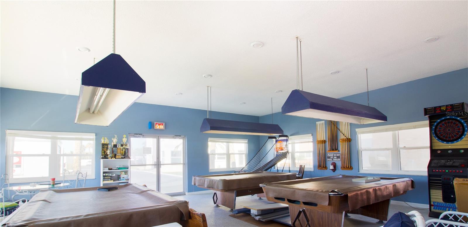 Well appointed game room with pool tables basketball shoot darts poker and much more