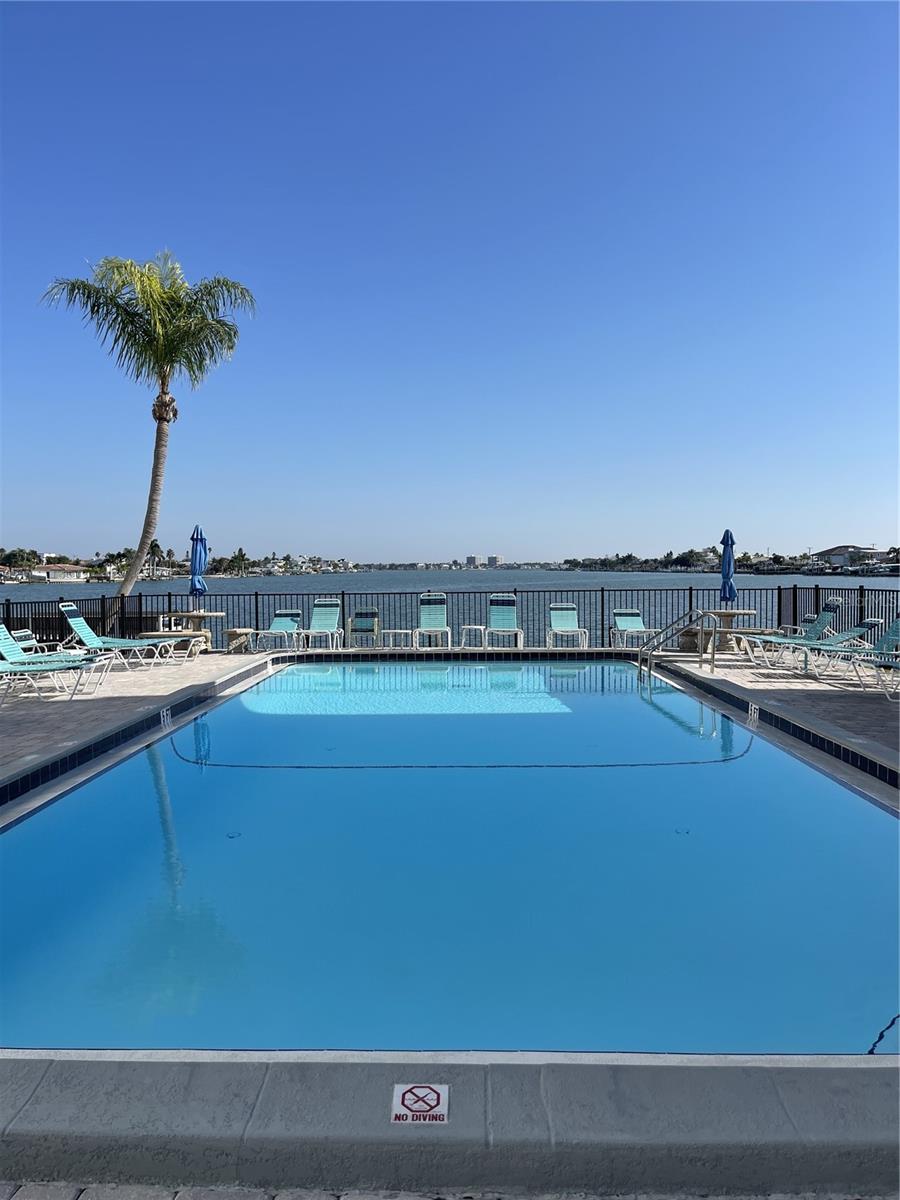 Resort style living with Boca Ciega Bay views from your pool