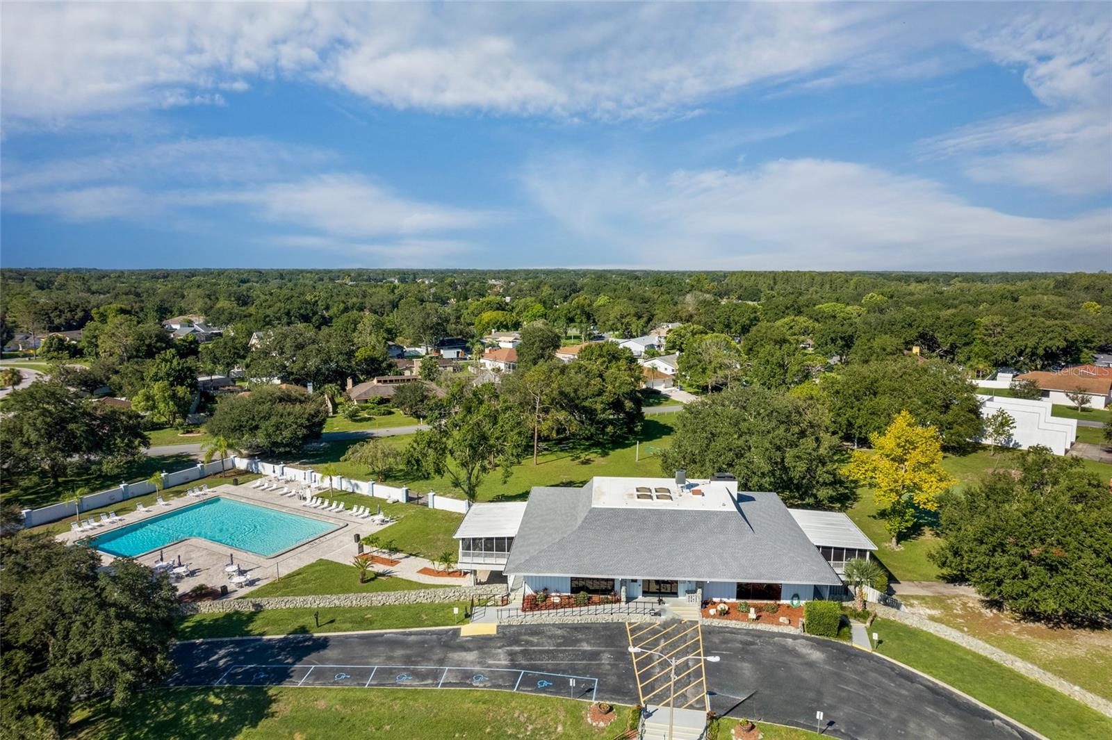 clubhouse with billiards and community pool for swimming or sunning