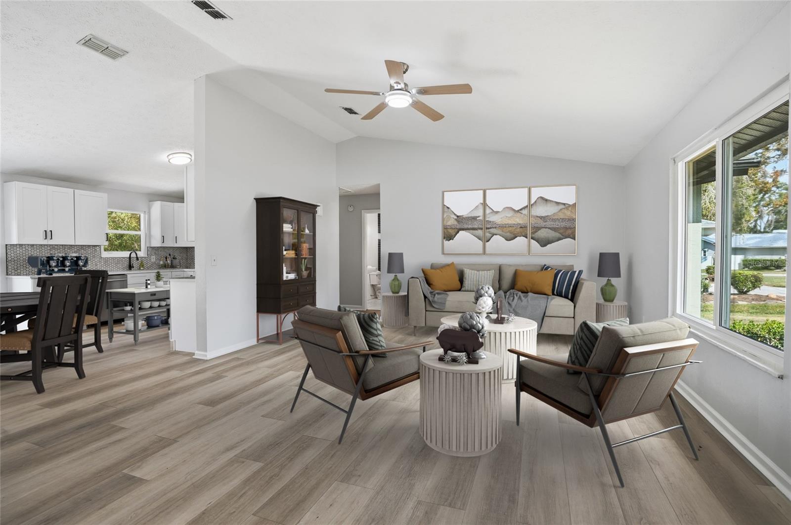 virtually stage large family room with amazing window view and kitchen with eat-in space