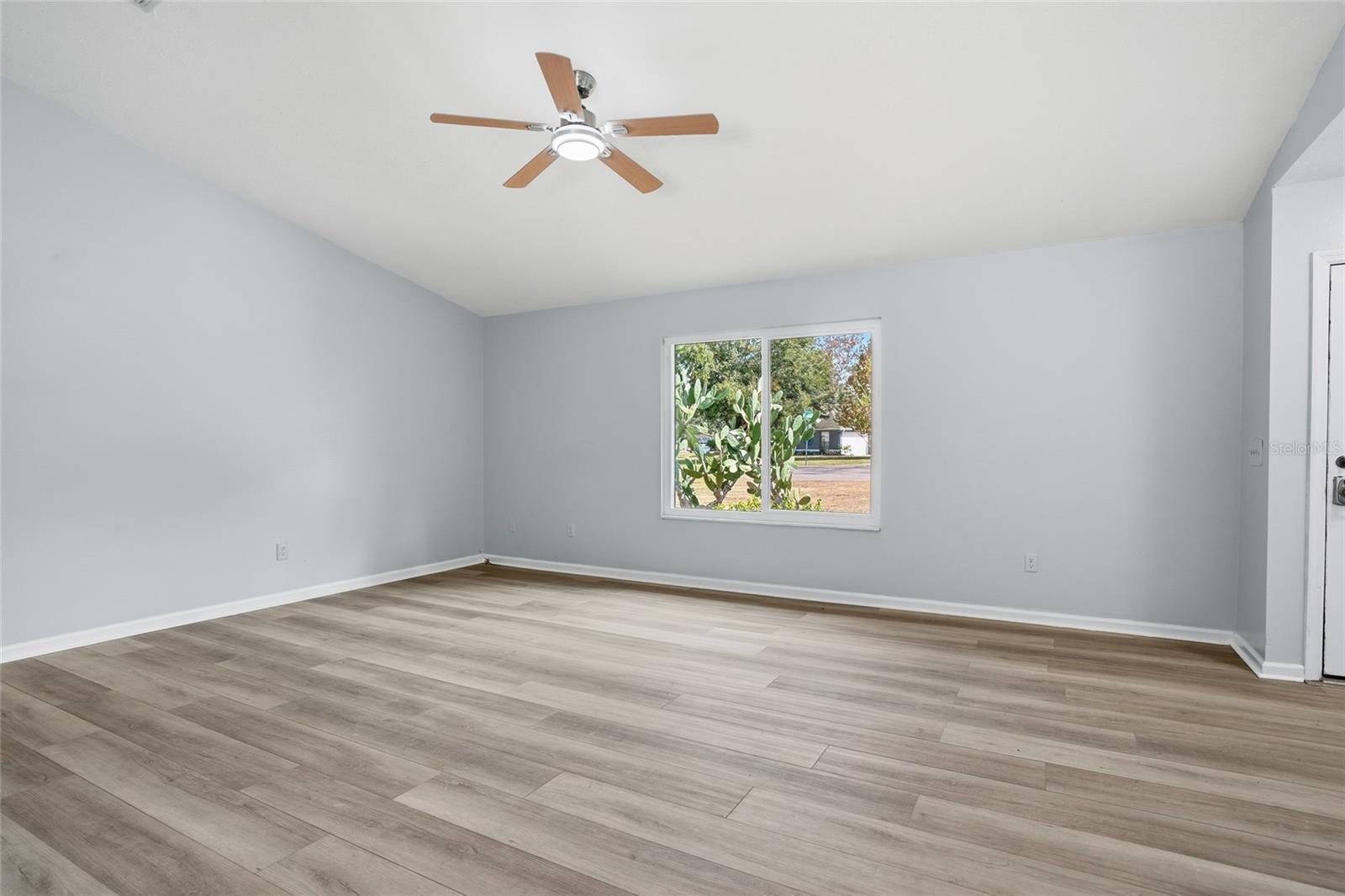 family room with a view and all new interior paint and fan