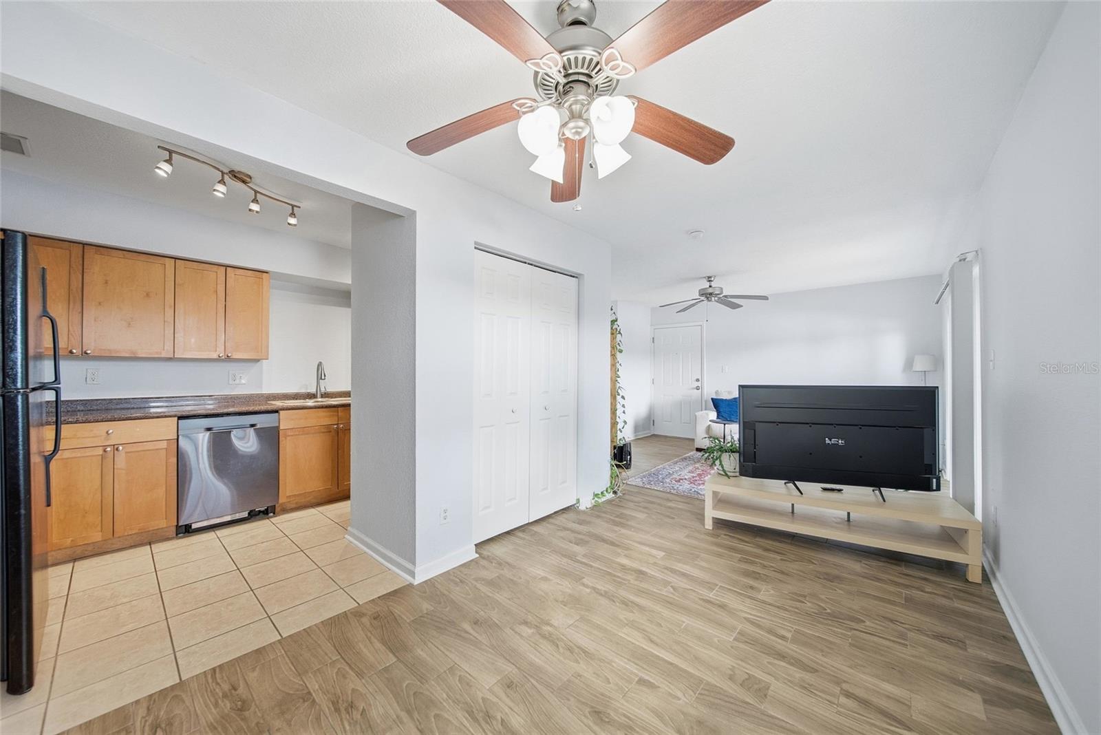 View of the dining room and kitchen.  There is a good size storage closet in the dining room.