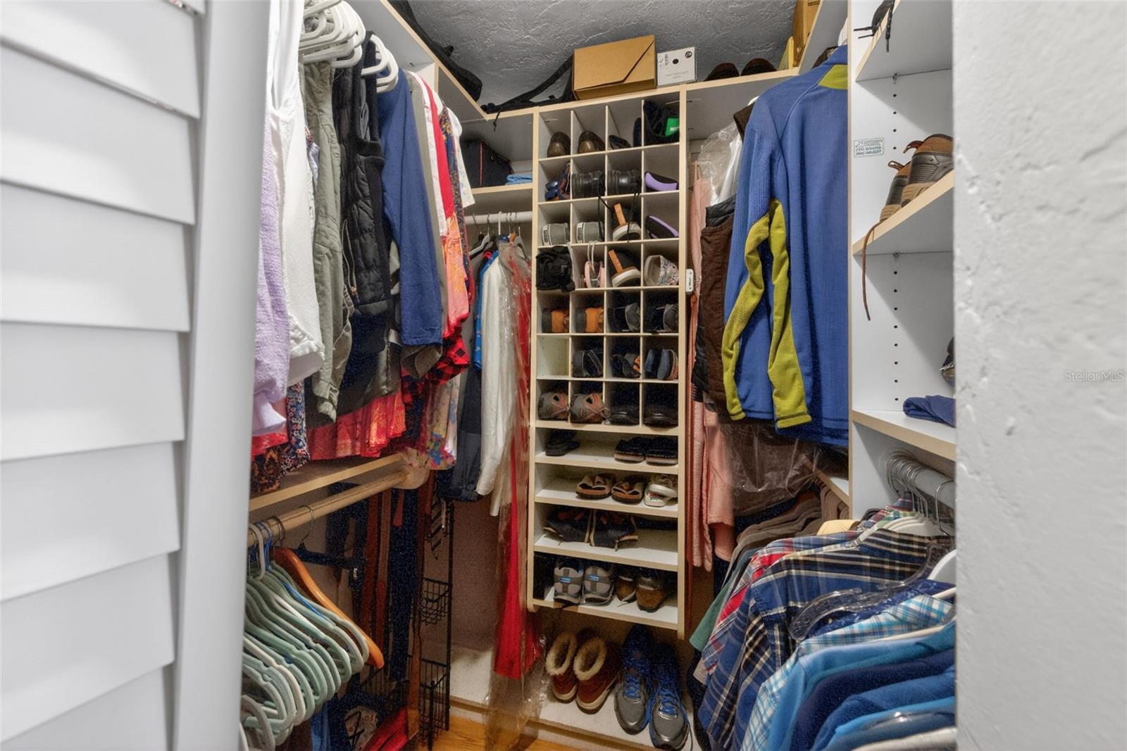 Primary bedroom walk-in closet