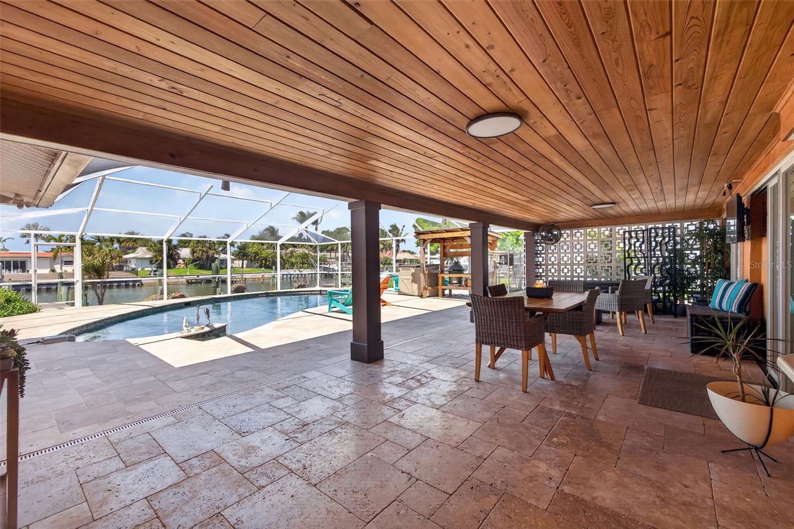 Spacious covered patio with a stunning cypress ceiling