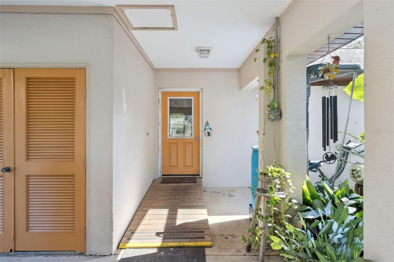 Rear entry off carport/patio