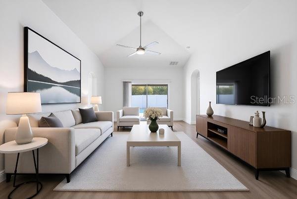 Vaulted Ceilings - Living Room/ Family Room looking out to the Lanai and Pool/Spa