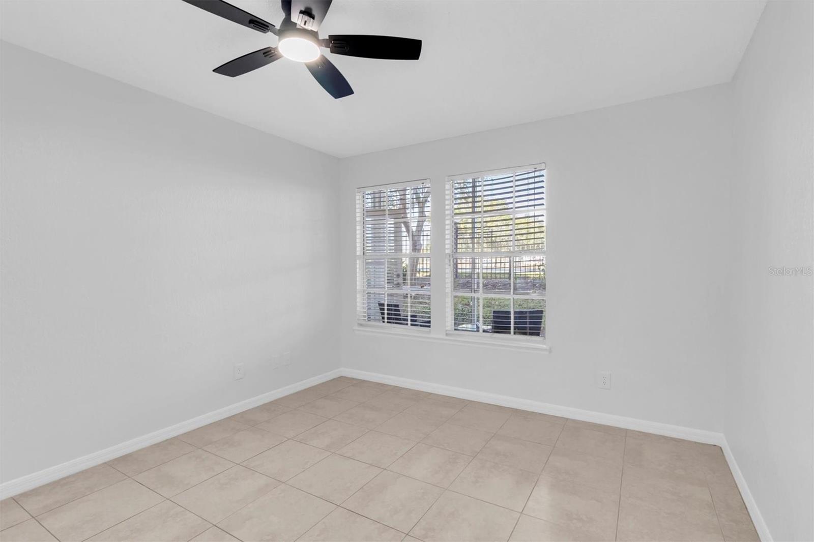 Primary bedroom with bright natural light