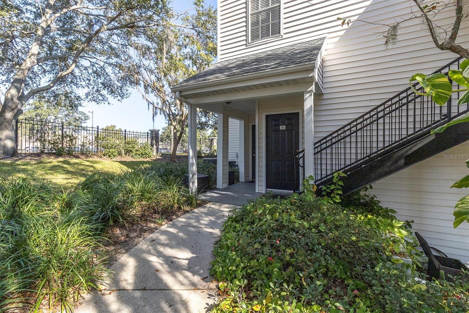 Private walkway with beautiful landscaping to your door