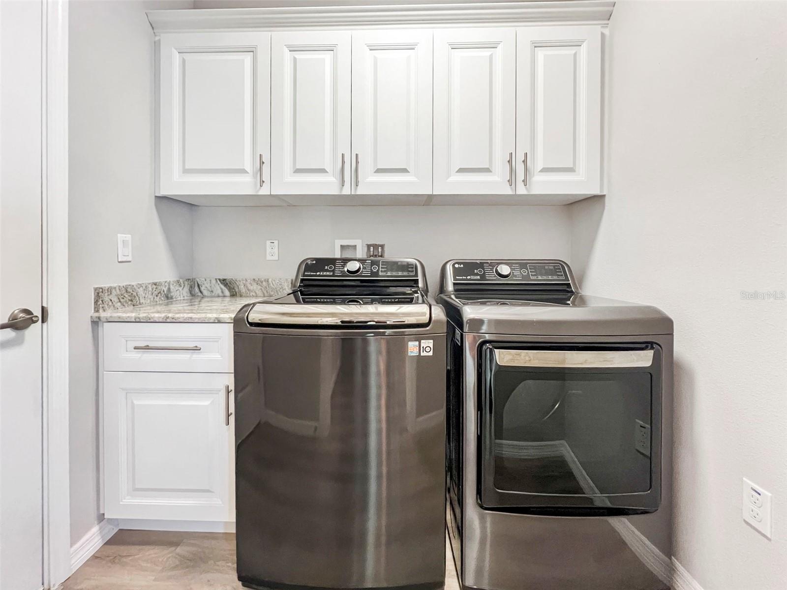 More cabinetry with LG washer and dryer