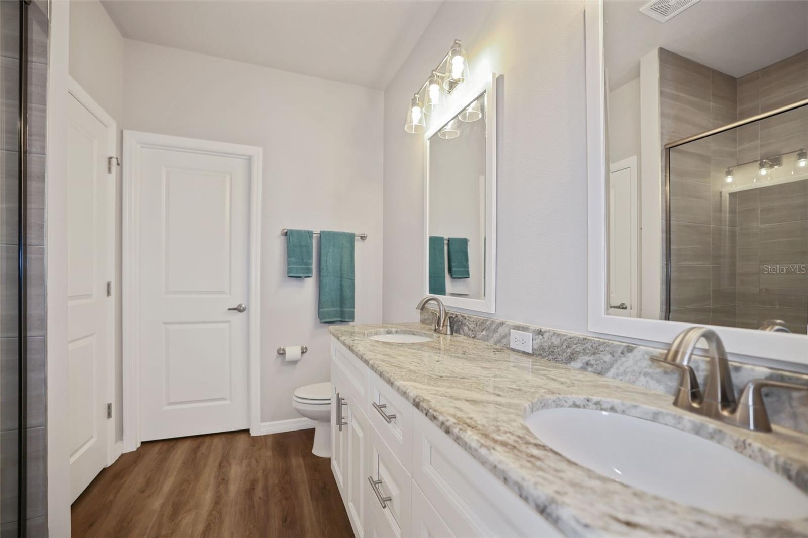 Primary bathroom has two closets