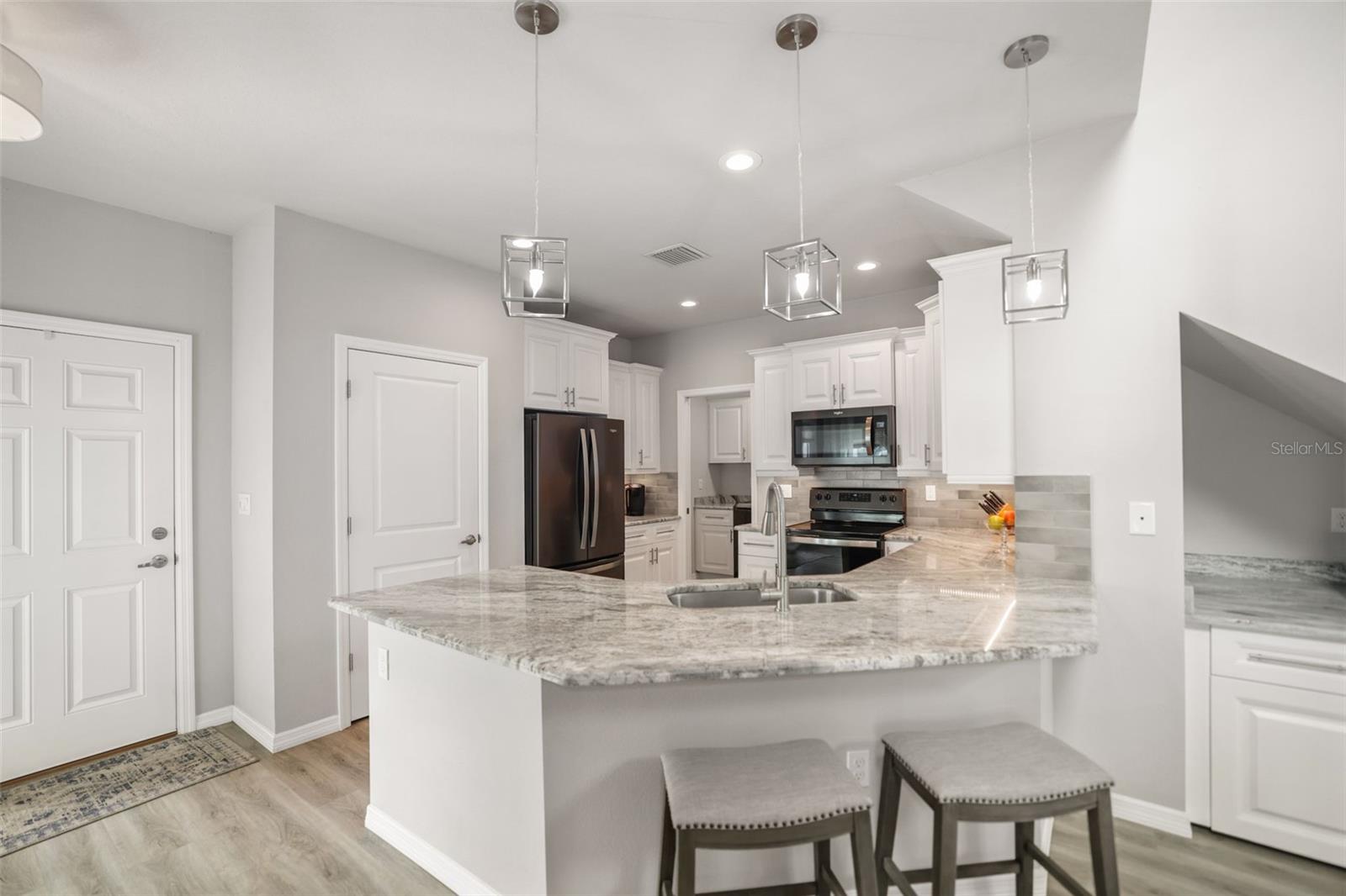 Open kitchen with breakfast bar