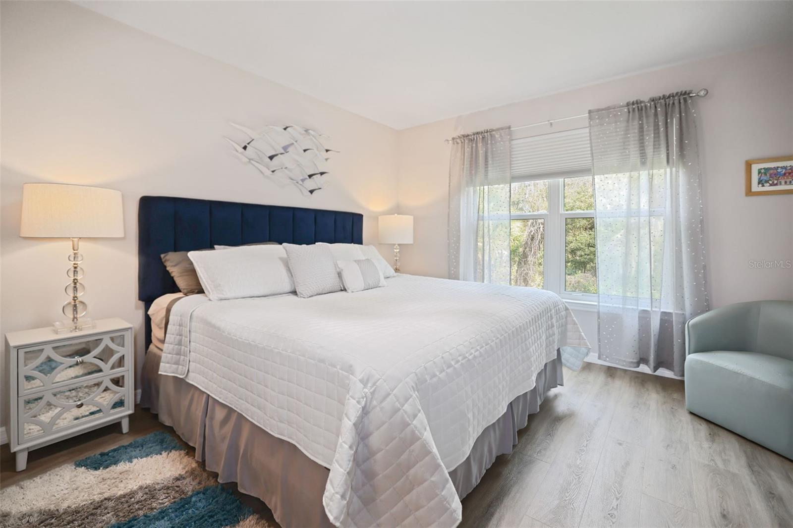 Large bedroom with view of nature preserve