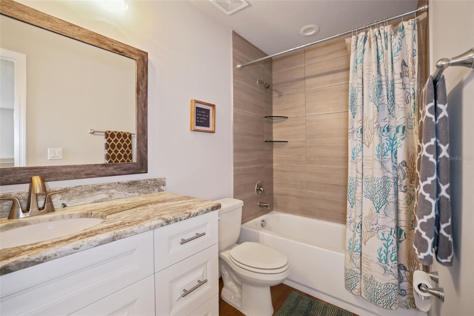 Upstairs full bathroom with tub and shower