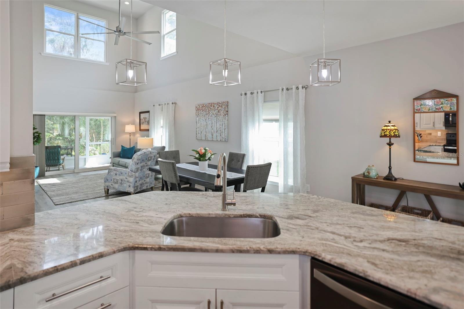 Kitchen overlooks dining/living area