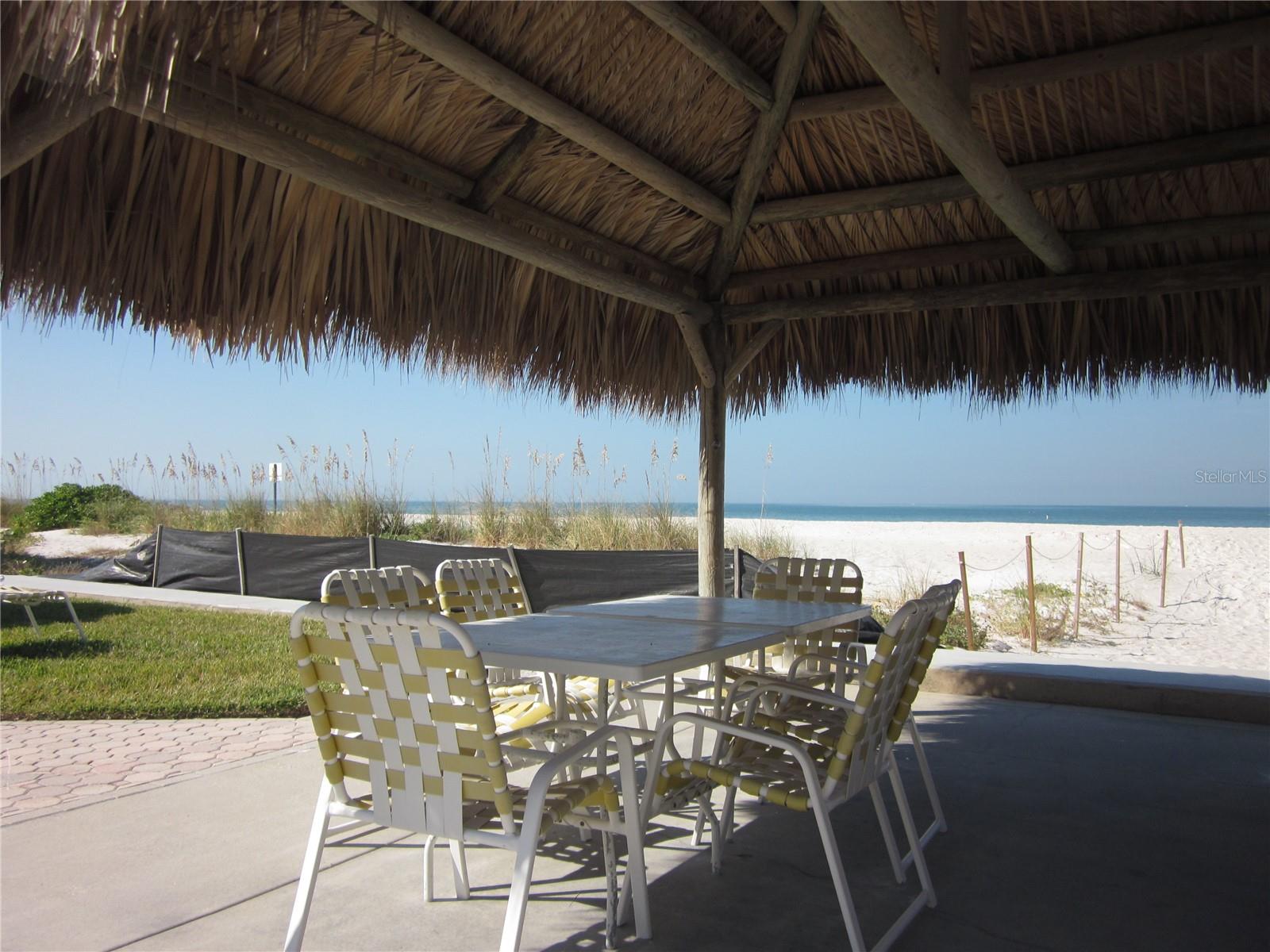 Community tables for enjoying picnics by the beach & pool