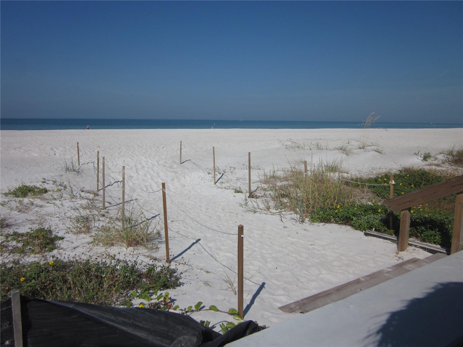 Just steps to the beach & sparking Gulf